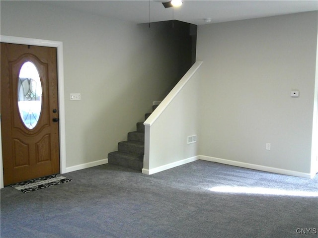 8457 S Main St, Le Ray, NY 13637 - foyer with carpet floors, baseboards, and stairs
