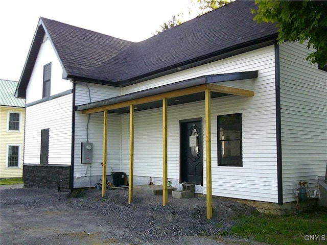 8457 S Main St, Le Ray, NY 13637 - back of property featuring roof with shingles