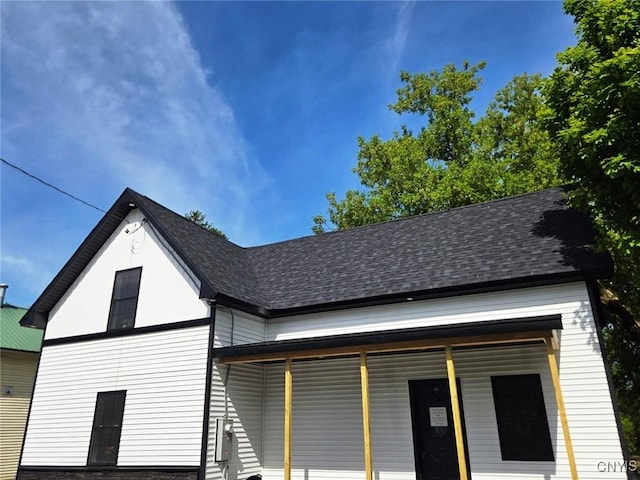 8457 S Main St, Le Ray, NY 13637 - view of side of home with a shingled roof