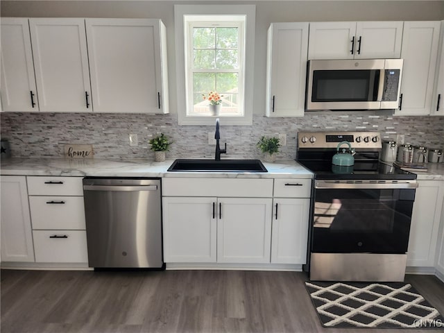 8457 S Main St, Le Ray, NY 13637 - kitchen featuring stainless steel appliances, wood finished floors, and white cabinetry