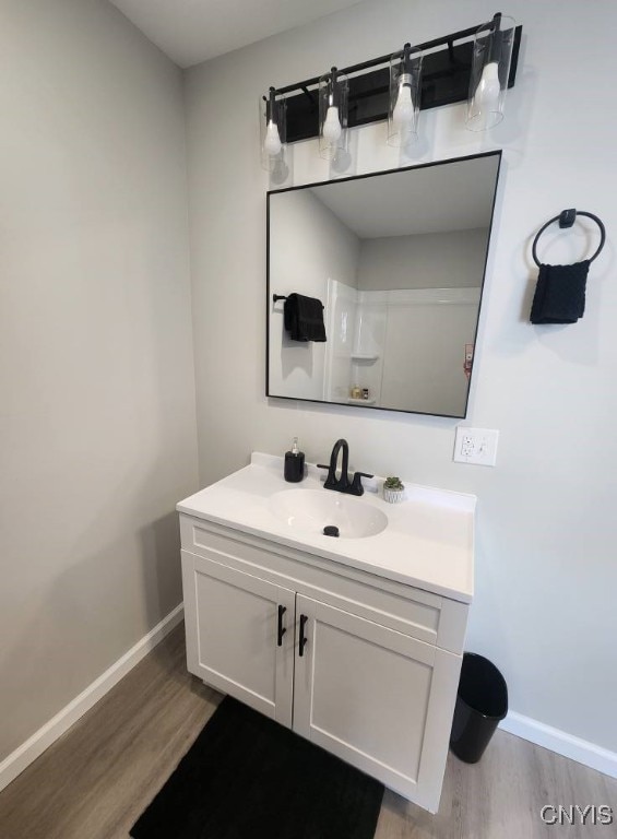 8457 S Main St, Le Ray, NY 13637 - bathroom with wood finished floors and vanity
