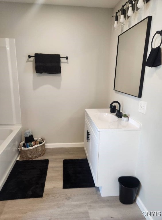 8457 S Main St, Le Ray, NY 13637 - full bathroom with vanity and wood finished floors