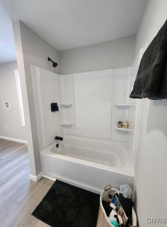 8457 S Main St, Le Ray, NY 13637 - full bathroom featuring wood finished floors and  shower combination