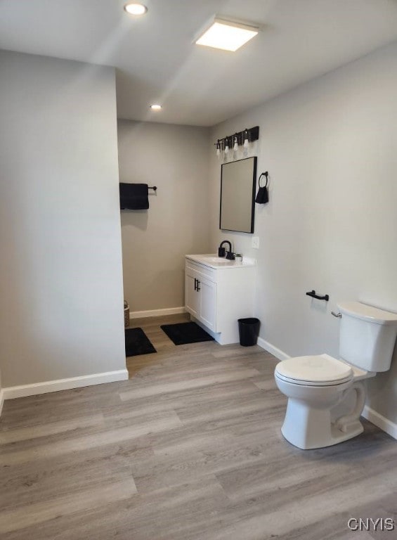 8457 S Main St, Le Ray, NY 13637 - bathroom with vanity, wood finished floors, and recessed lighting