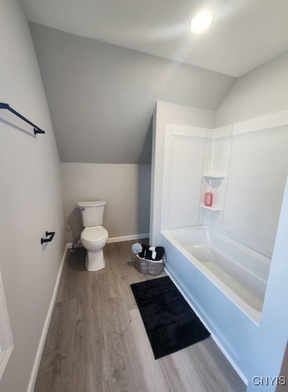 8457 S Main St, Le Ray, NY 13637 - full bathroom with vaulted ceiling and wood finished floors