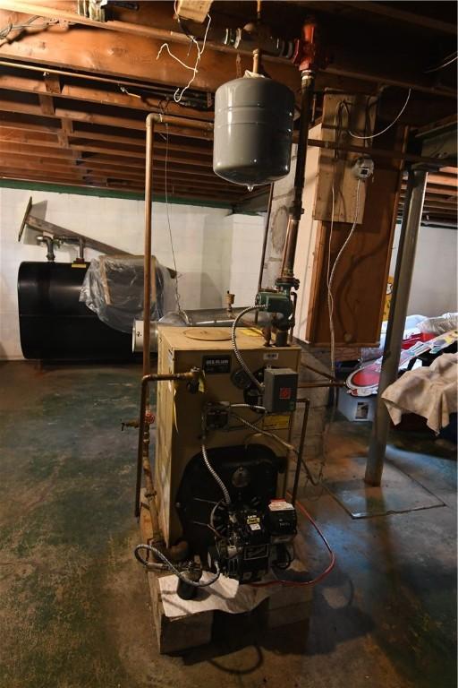 158 Dingman Hill Rd, Bainbridge, NY 13733 - utility room featuring a heating unit and oil tank