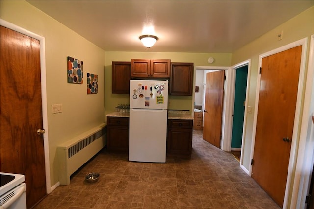 158 Dingman Hill Rd, Bainbridge, NY 13733 - kitchen with freestanding refrigerator, radiator, baseboards, and stone finish flooring