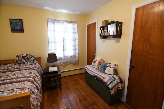 158 Dingman Hill Rd, Bainbridge, NY 13733 - bedroom featuring a baseboard heating unit and wood finished floors
