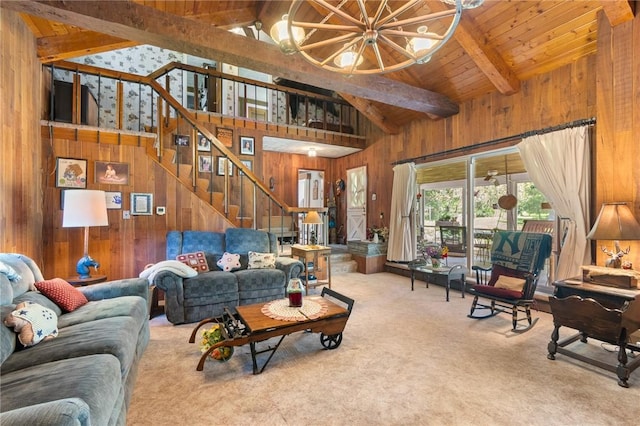 4482 Cory Corners Rd, Marion, NY 14505 - carpeted living area with a chandelier, wood walls, stairs, wooden ceiling with exposed beams, and high vaulted ceiling