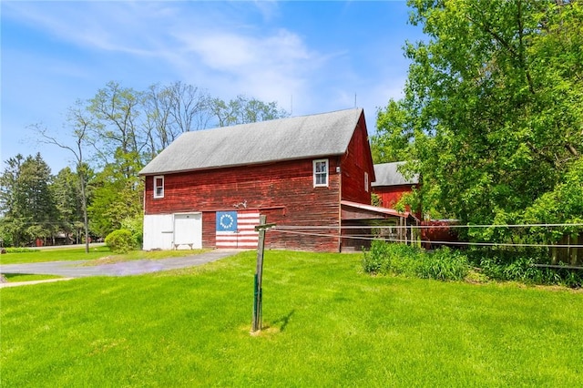 4482 Cory Corners Rd, Marion, NY 14505 - view of property exterior featuring a barn, a yard, and an outbuilding