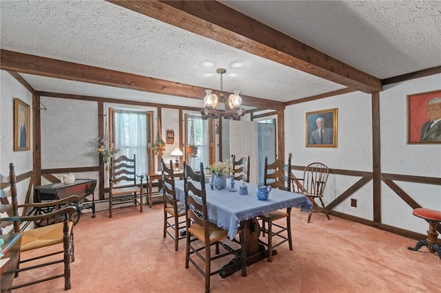 4482 Cory Corners Rd, Marion, NY 14505 - dining space with a textured ceiling, light carpet, beamed ceiling, a chandelier, and baseboards