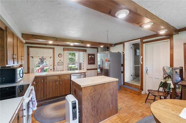 4482 Cory Corners Rd, Marion, NY 14505 - kitchen featuring stainless steel appliances, a sink, a textured ceiling, brown cabinets, and wooden counters