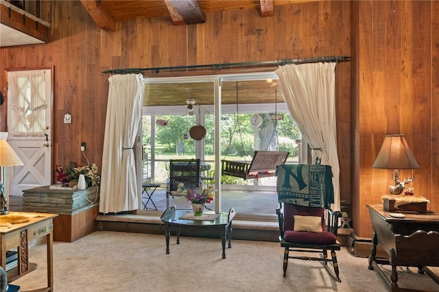 4482 Cory Corners Rd, Marion, NY 14505 - living area featuring wood walls, wood ceiling with exposed beams, and carpet