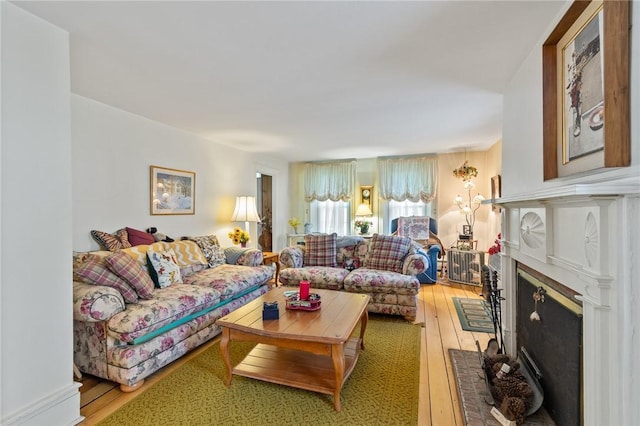 4482 Cory Corners Rd, Marion, NY 14505 - living room with light wood-style floors and a brick fireplace