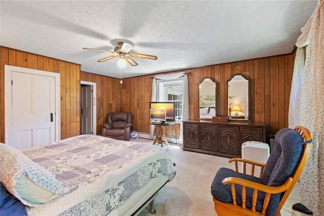 4482 Cory Corners Rd, Marion, NY 14505 - bedroom featuring wood walls, a baseboard heating unit, light carpet, and a ceiling fan