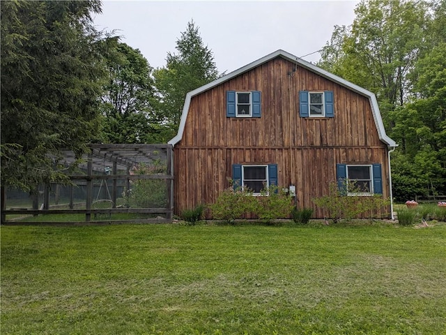 73 Derosia Rd, Lafayette, PA 16738 - view of property exterior with a gambrel roof, a lawn, and a barn