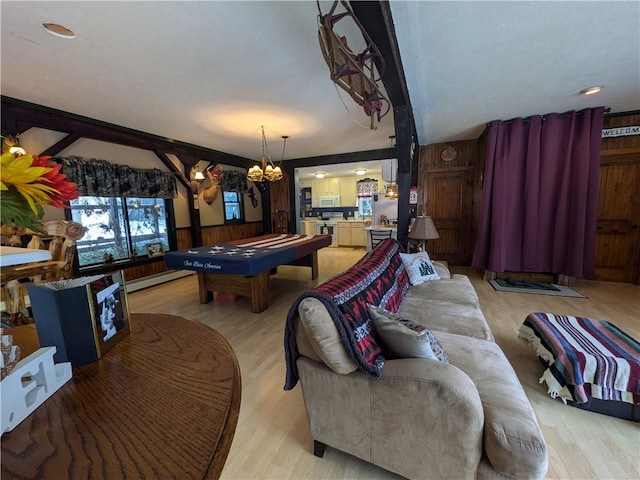 73 Derosia Rd, Lafayette, PA 16738 - recreation room with pool table, a baseboard radiator, light wood-style floors, a chandelier, and wooden walls