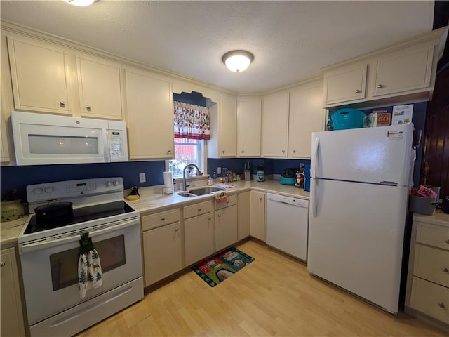73 Derosia Rd, Lafayette, PA 16738 - kitchen featuring white appliances, a sink, light countertops, light wood-style flooring, and white cabinetry