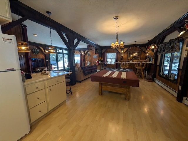73 Derosia Rd, Lafayette, PA 16738 - playroom with a chandelier, baseboard heating, and light wood-style flooring