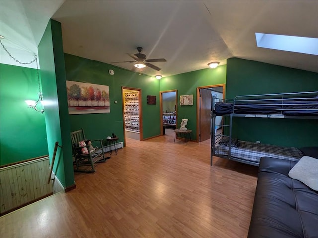 73 Derosia Rd, Lafayette, PA 16738 - bedroom featuring wood finished floors, a skylight, and vaulted ceiling