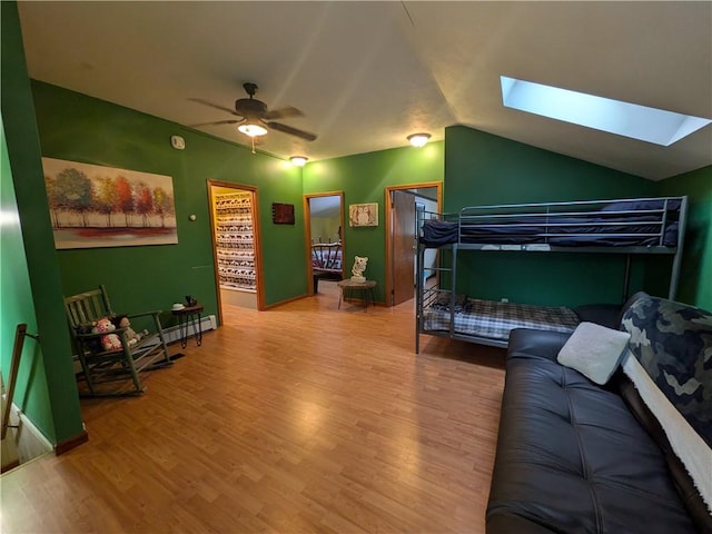 73 Derosia Rd, Lafayette, PA 16738 - bedroom with wood finished floors, a skylight, vaulted ceiling, and ceiling fan