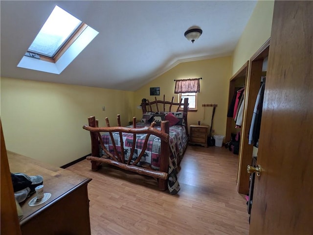 73 Derosia Rd, Lafayette, PA 16738 - bedroom with a skylight, lofted ceiling, and light wood finished floors