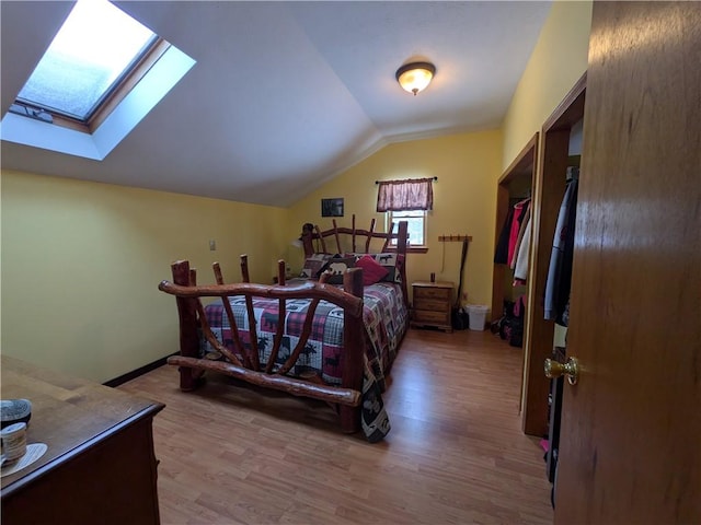 73 Derosia Rd, Lafayette, PA 16738 - bedroom with a skylight, lofted ceiling, wood finished floors, and baseboards