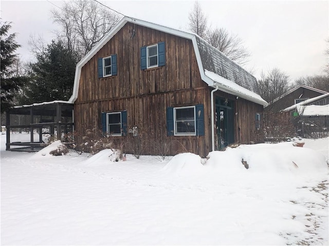 73 Derosia Rd, Lafayette, PA 16738 - view of snowy exterior featuring a gambrel roof