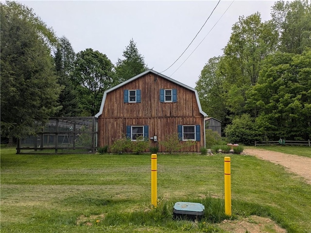 73 Derosia Rd, Lafayette, PA 16738 - view of property exterior with a gambrel roof and a yard