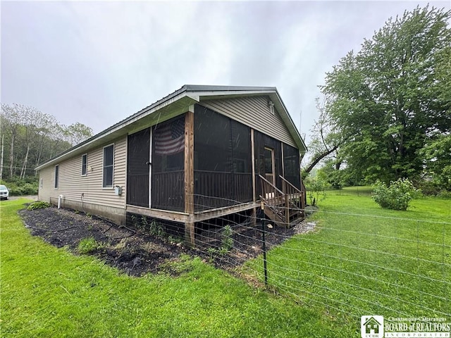 131 Goose Creek Rd, Busti, NY 14710 - view of side of home featuring a sunroom and a yard