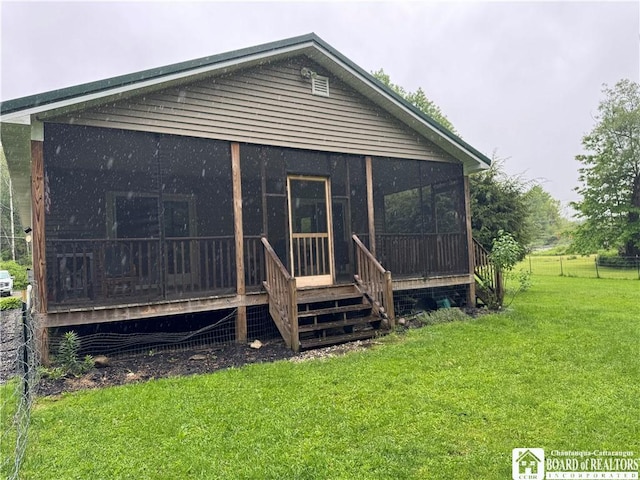 131 Goose Creek Rd, Busti, NY 14710 - rear view of house with a sunroom and a yard