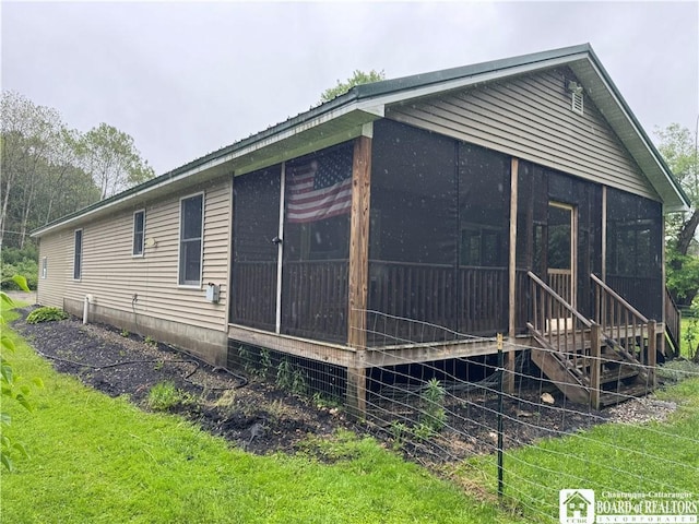 131 Goose Creek Rd, Busti, NY 14710 - view of side of property featuring a sunroom and a yard