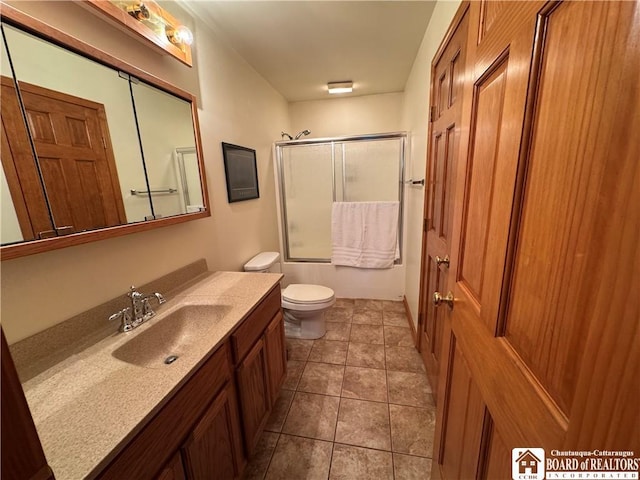 131 Goose Creek Rd, Busti, NY 14710 - bathroom featuring vanity, toilet, combined bath / shower with glass door, and tile patterned flooring