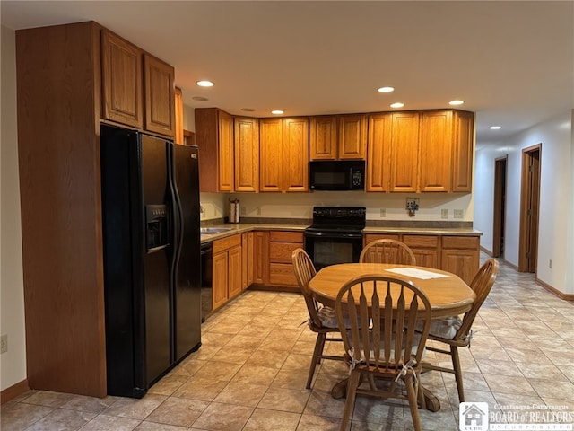 131 Goose Creek Rd, Busti, NY 14710 - kitchen with black appliances, recessed lighting, and brown cabinetry