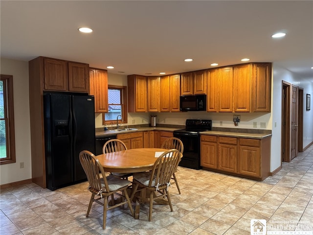 131 Goose Creek Rd, Busti, NY 14710 - kitchen with black appliances, brown cabinets, and recessed lighting