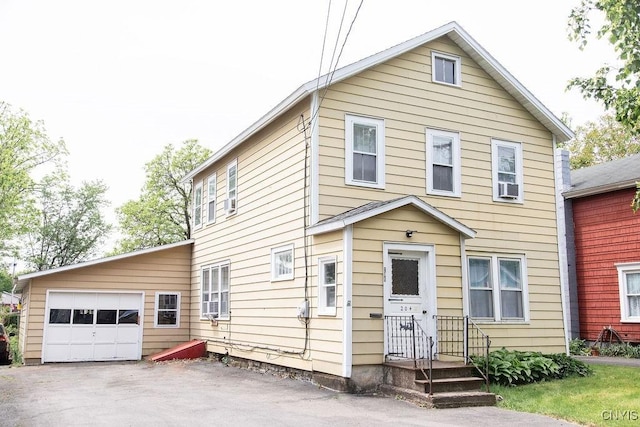 204 E Ellis St, Dewitt, NY 13057 - view of front of home with driveway and an attached garage