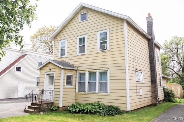 204 E Ellis St, Dewitt, NY 13057 - back of property with a chimney