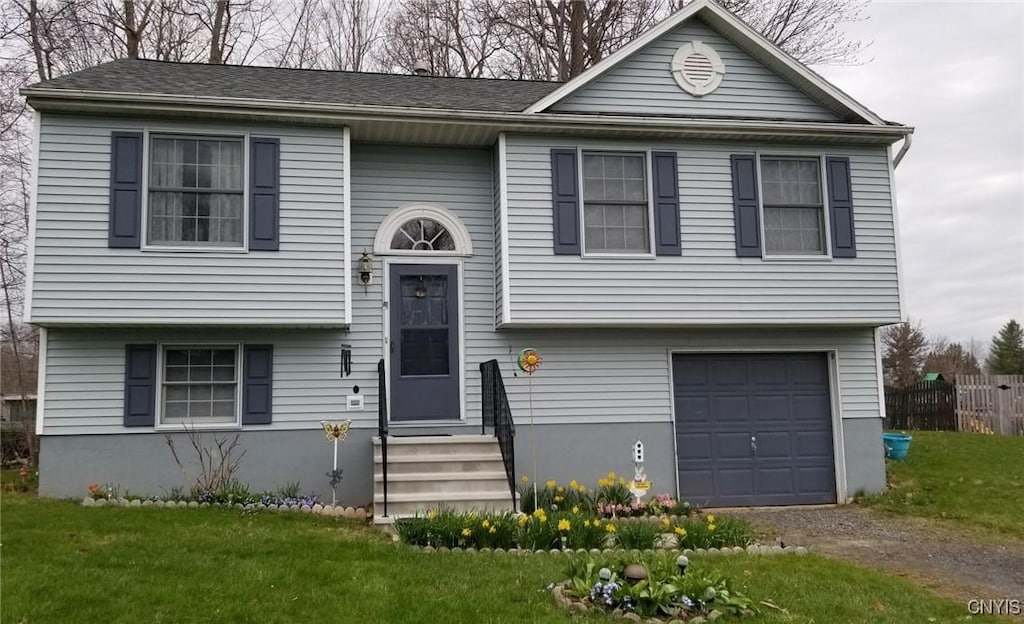9557 Bantry Ln, Cicero, NY 13029 - bi-level home with an attached garage, entry steps, a front yard, and driveway