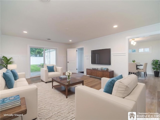 413 Chautauqua Ave, Jamestown, NY 14701 - living area with light wood-style flooring, a decorative wall, crown molding, recessed lighting, and wainscoting