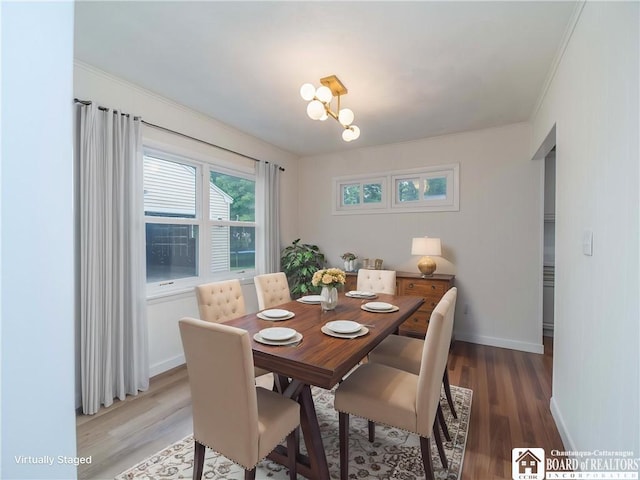 413 Chautauqua Ave, Jamestown, NY 14701 - dining room featuring light wood-type flooring, crown molding, baseboards, and a chandelier