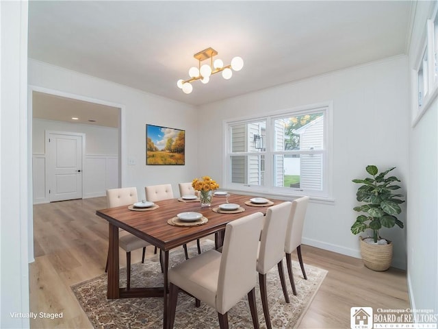 413 Chautauqua Ave, Jamestown, NY 14701 - dining space with ornamental molding, light wood-type flooring, a chandelier, and baseboards