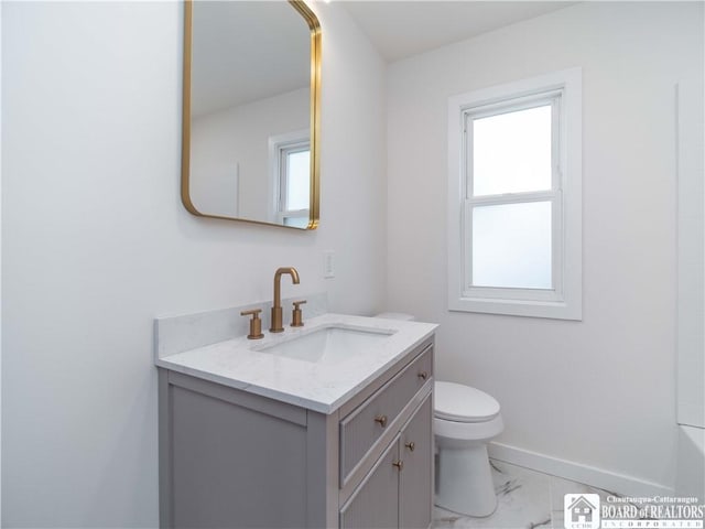 413 Chautauqua Ave, Jamestown, NY 14701 - bathroom with vanity, marble finish flooring, toilet, and baseboards