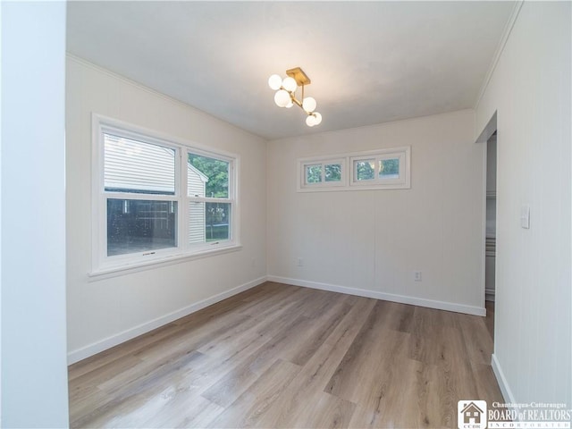 413 Chautauqua Ave, Jamestown, NY 14701 - empty room with ornamental molding, light wood finished floors, a chandelier, and baseboards