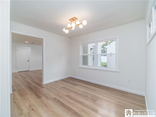 413 Chautauqua Ave, Jamestown, NY 14701 - unfurnished room with a chandelier, ornamental molding, light wood-style floors, and baseboards
