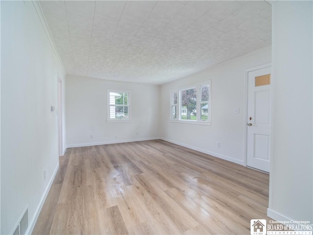 413 Chautauqua Ave, Jamestown, NY 14701 - unfurnished room featuring light wood-style floors, ornamental molding, and baseboards