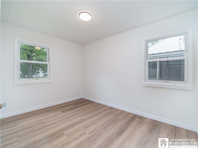 413 Chautauqua Ave, Jamestown, NY 14701 - spare room featuring light wood-style flooring, plenty of natural light, and baseboards
