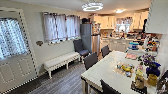 76 Sandra Dr, Cheektowaga, NY 14225 - kitchen with freestanding refrigerator, white cabinets, dark wood finished floors, and a sink