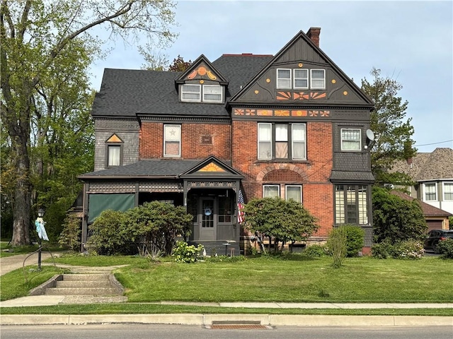 110 Edgar James St, Kane Boro, PA 16735 - view of front of property with a front lawn, a chimney, and brick siding
