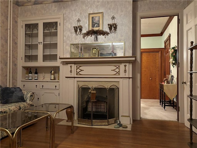 110 Edgar James St, Kane Boro, PA 16735 - sitting room with wood finished floors, crown molding, and a fireplace with flush hearth