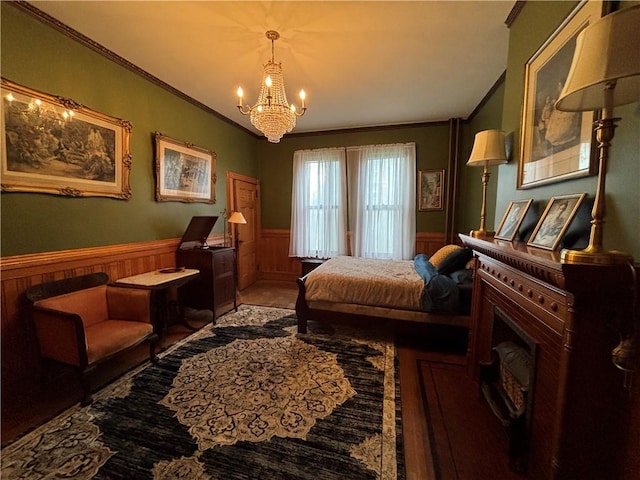110 Edgar James St, Kane Boro, PA 16735 - bedroom with a wainscoted wall, ornamental molding, a chandelier, and wood finished floors